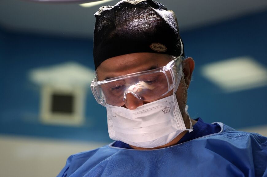 Rhinoplasty surgeon Hamidreza Hosnani performs up to 20 operations a week at his well-equipped clinic in the capital