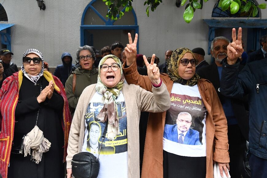 Relatives of convicted opposition figures protest outside the court in Tunis on April 21