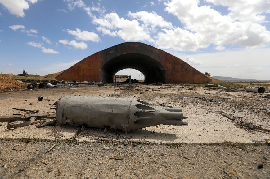 Debris on the ground after an Israeli strike on a Syrian military facility in Hama 