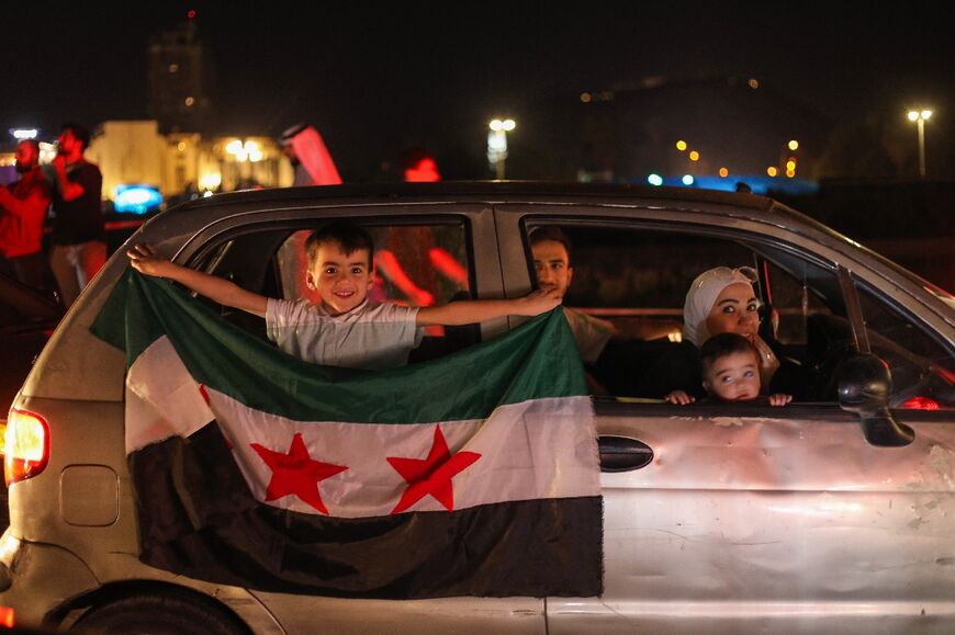 Syrians celebrate President Donald Trump's announcement that he will lift US sanctions on the war-battered country.