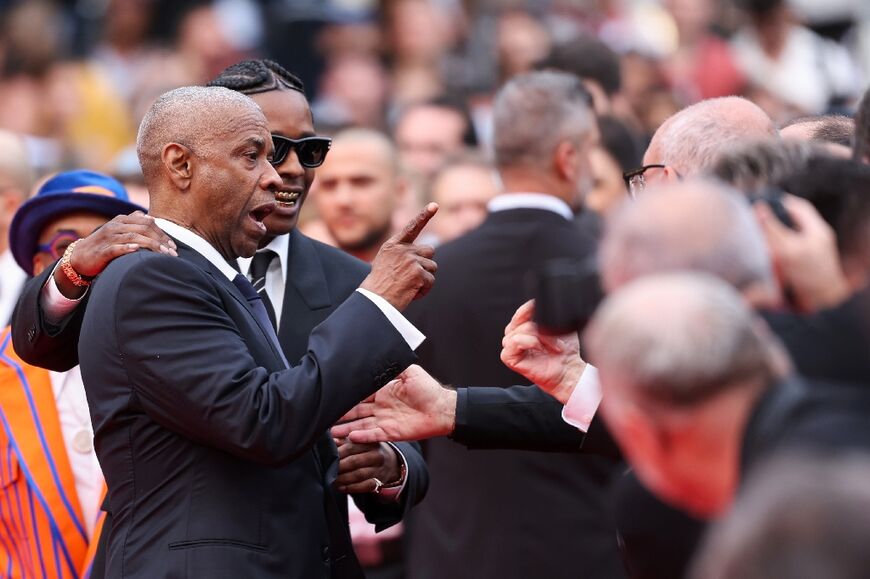 US actor Denzel Washington ticks off a photographer at the Cannes film festival