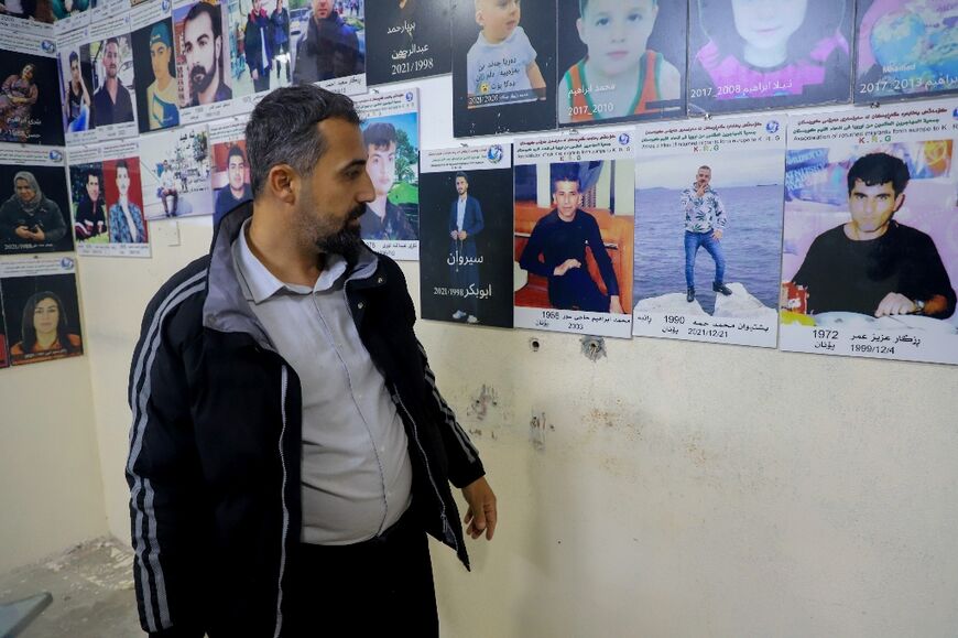 Hardi Ahmed with pictures of people who lost their lives trying to reach Europe