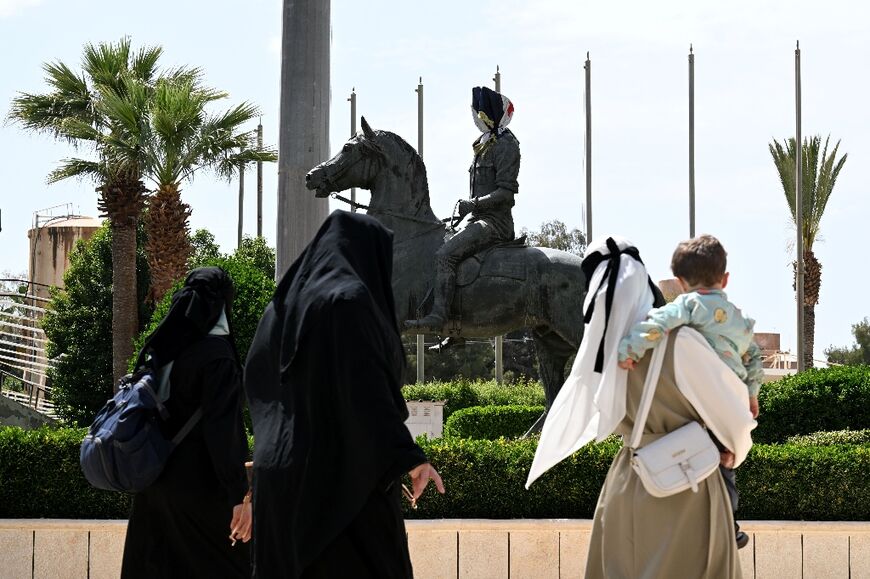 A statue of ousted president Bashar al-Assad's late brother, Bassel, still stands outside the Dimas equestrian club near Damascus