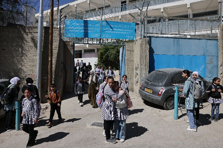 Palestinian schoolgirls leave a UNWRA school in the Shoafat refugee camp in east Jerusalem