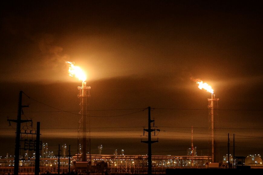 Gas flares at an oil refinery near the Huwaizah marshes