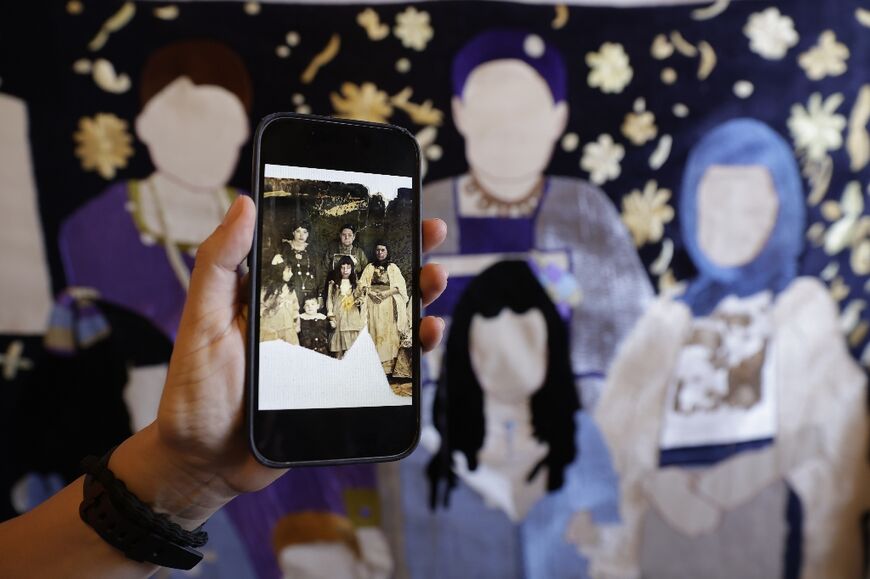 An old photograph being used as the basis for one artwork