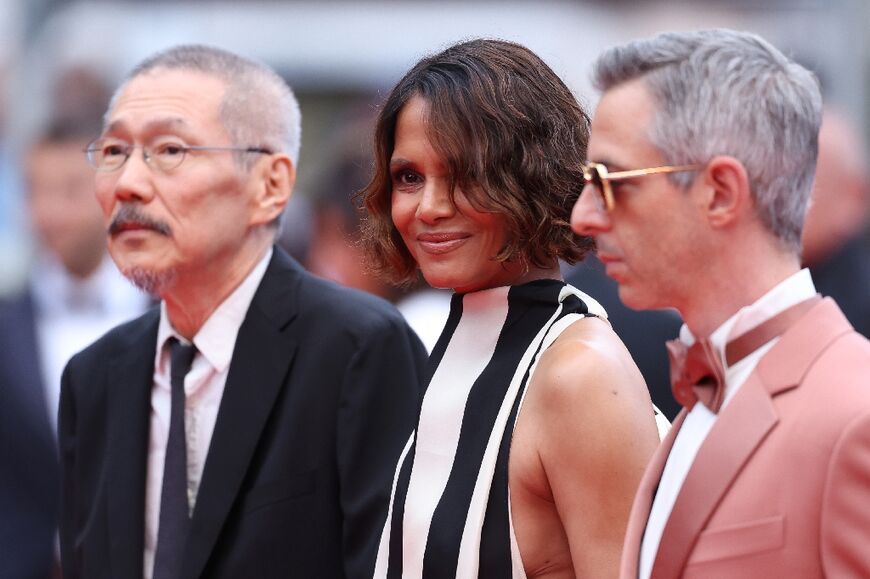Berry stands between fellow jury members Hong Sang-Soo from South Korea and US actor Jeremy Strong 