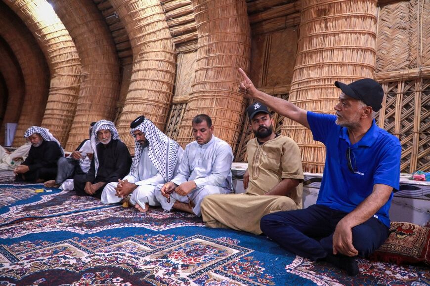 Environmental activists meet with indigenous people in Iraq's receding Huwaizah marshlands