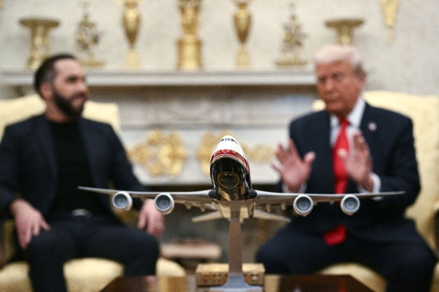 A model of a proposed redesign of Air Force One sits on Trump's coffee table in the Oval Office 