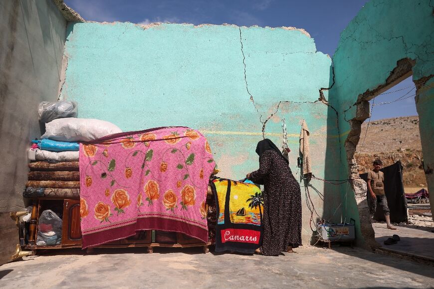 The roof of Souad Othman's home has collapsed and its walls are cracked, but she still chose to return