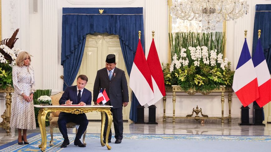 France's President Emmanuel Macron travelled with his wife Brigitte