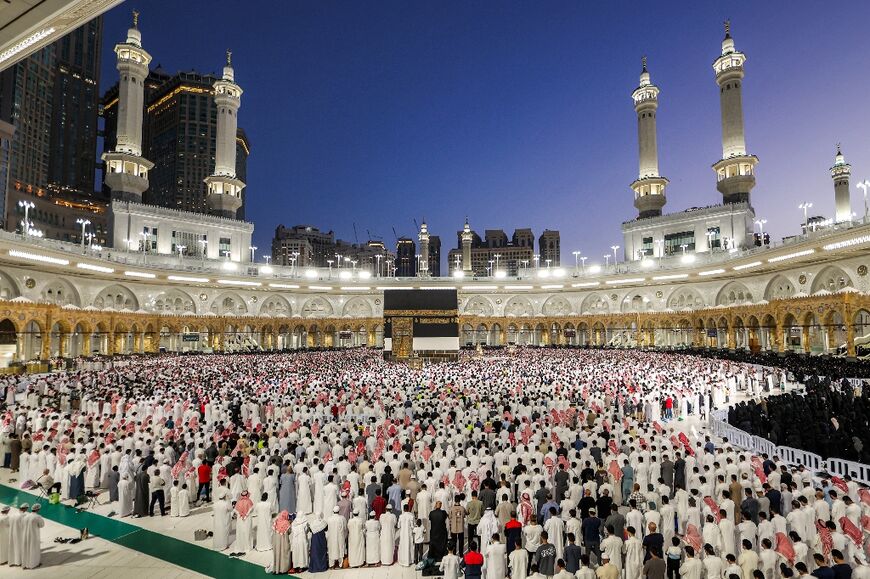 Muslim worshippers gather to pray around the Kaaba, Islam's holiest shrine, at the Grand Mosque complex in the holy city of Mecca 
