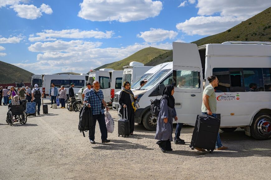 Iranians arrive in Turkey through the Razi-Kapikoy border crossing, north-eastern Turkey on June 18, 2025