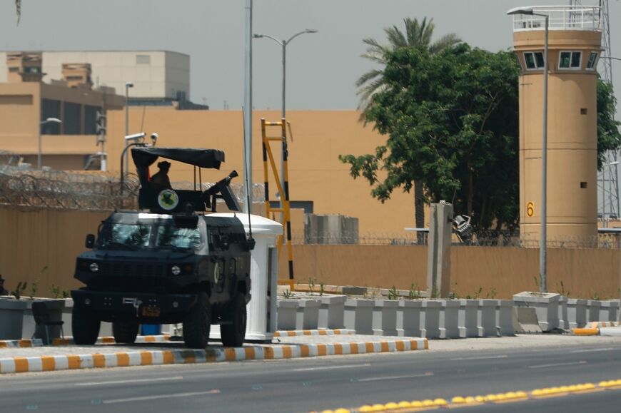Armored vehicles of the Iraqi Counter Terrorism Forces are deployed outside the US embassy building in Baghdad's Green Zone