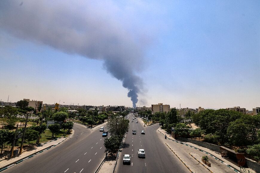 Heavy smoke rises from the site of an oil refinery in southern Tehran on Sunday