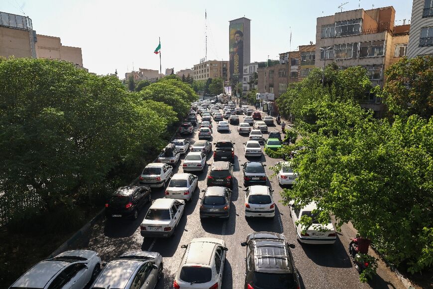 Traffic is jammed on a street in Tehran as people seek to leave the Iranian capital on June 15, 2025