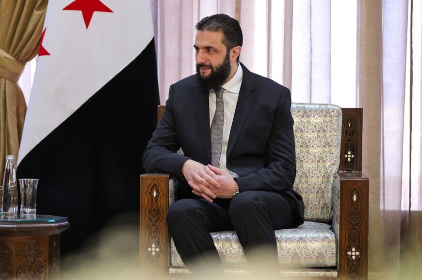 This handout picture released by the official Syrian Arab News Agency (SANA) shows Sharaa receiving Saudi Arabia's foreign minister in Damascus on May 31