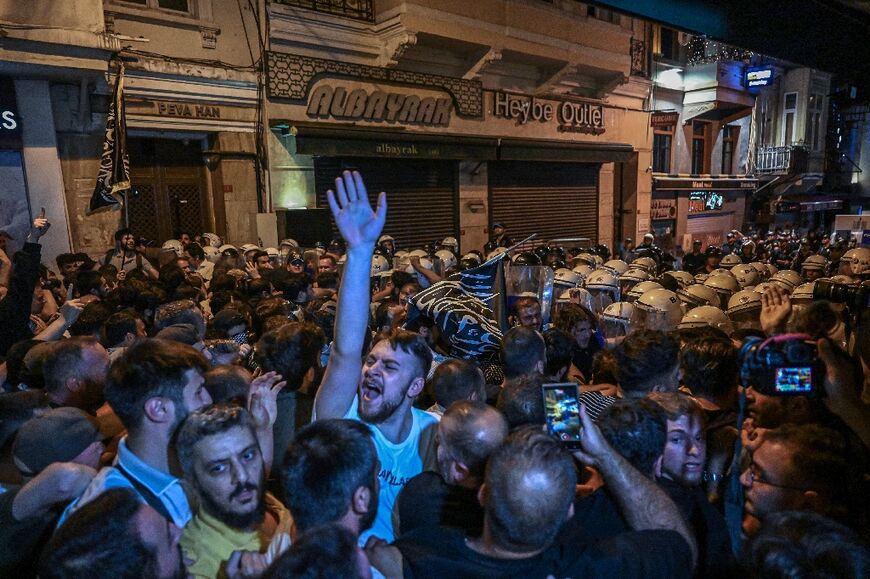 Clashes erupted in Istanbul with police firing rubber bullets and tear gas to break up an angry mob