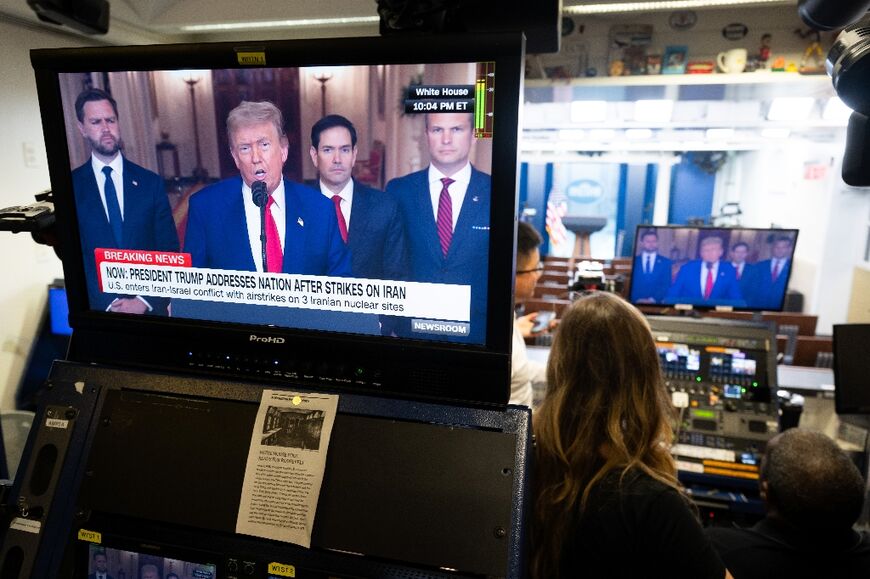 US President Donald Trump's address to the nation is seen in the White House briefing room