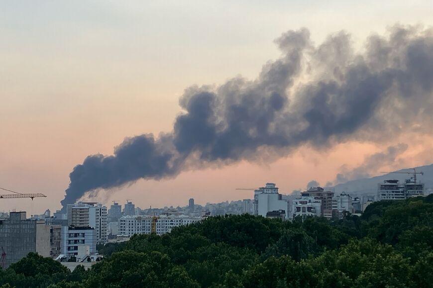 Smoke billows from an explosion at the Islamic Republic of Iran Broadcasting (IRIB) building in Tehran on June 16, 2025