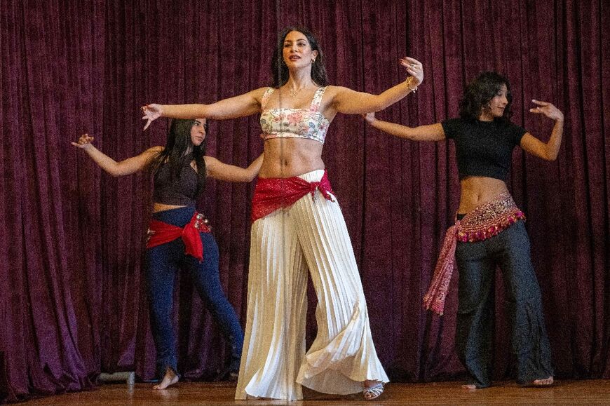 Sultan (C) and fellow dancers Safaa Saeed (L) and Menna Emmam (R) rehearse at a dance studio in Cairo