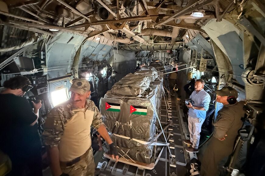 In this photo taken during a tour organised by the Jordanian military, airmen ready aid pallets to be dropped by parachute over Gaza.