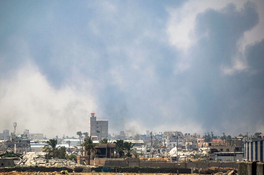 AFP photos from Deir el-Balah showed plumes of dark smoke billowing into the sky
