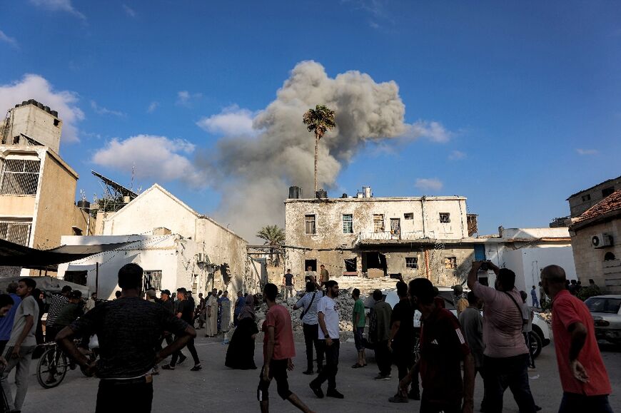 Smoke billowed after an Israeli strike in Gaza City
