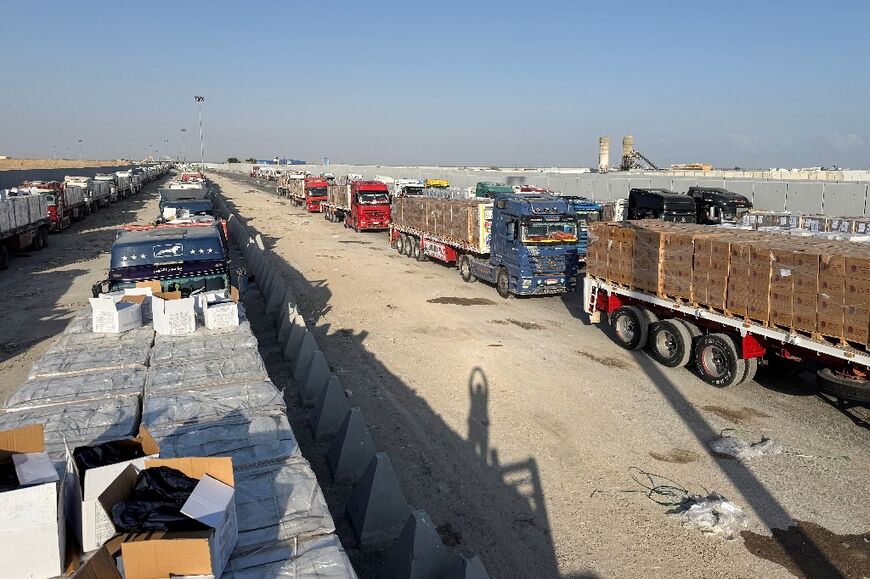 Long lines of aid trucks wait on the Egyptian side of the Gaza border for Israeli permission to enter the Palestinian territory.