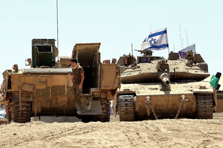 Israeli armoured vehicles near the border with the Gaza Strip, as the military prepares a new offensive in Gaza City