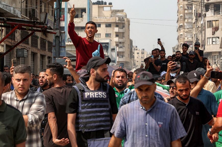 Mourners at the funeral of Al Jazeera journalists killed in an Israeli strike in Gaza City
