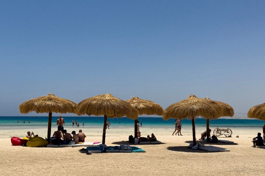 Tourists gather at the beach at Ras Hankorab on the Red Sea in southern Egypt