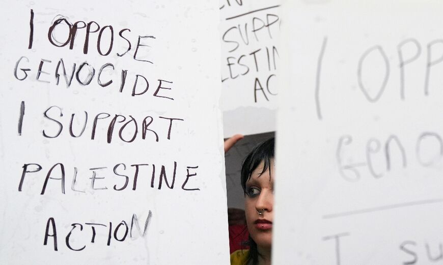 UK protesters hold up signs reading 'I oppose genocide, I support Palestine Action' 