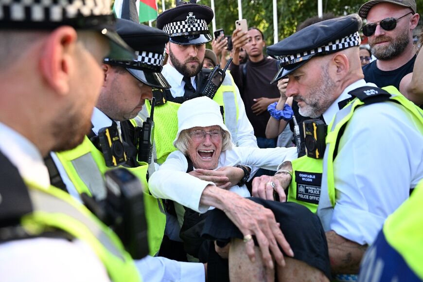 Over 500 people were arrested at a protest in London's Parliament Square on August 9 for displaying placards backing the group