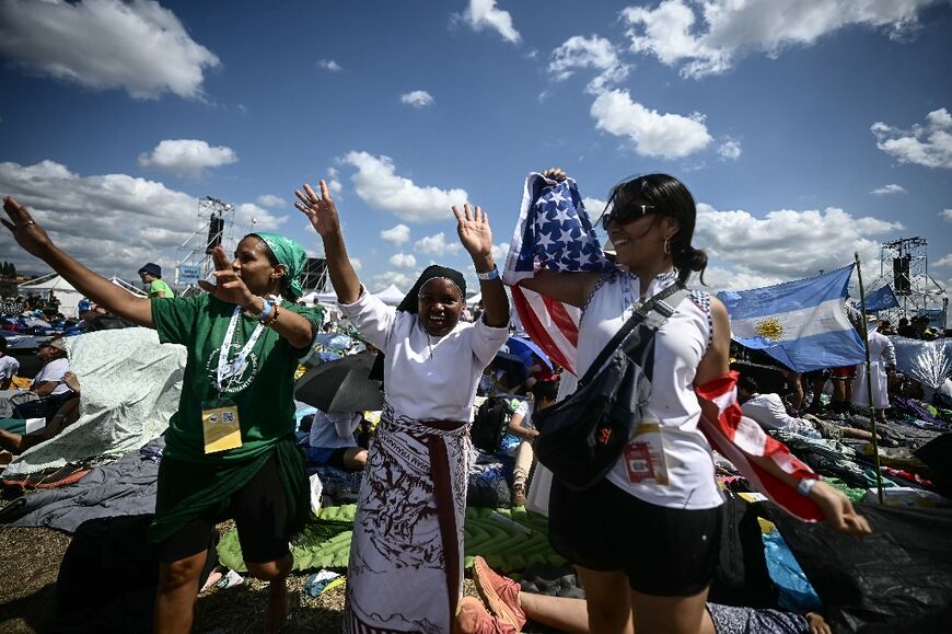 Attendees dance as they join youth and pilgrims gathering in Rome's eastern Tor Vergata neighbourhood for a prayer vigil led by the Pope 