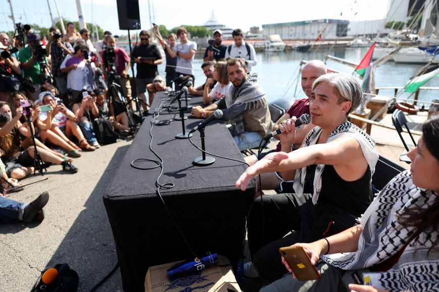 Former Barcelona mayor Ada Colau delivers a speech at the flotilla launch 