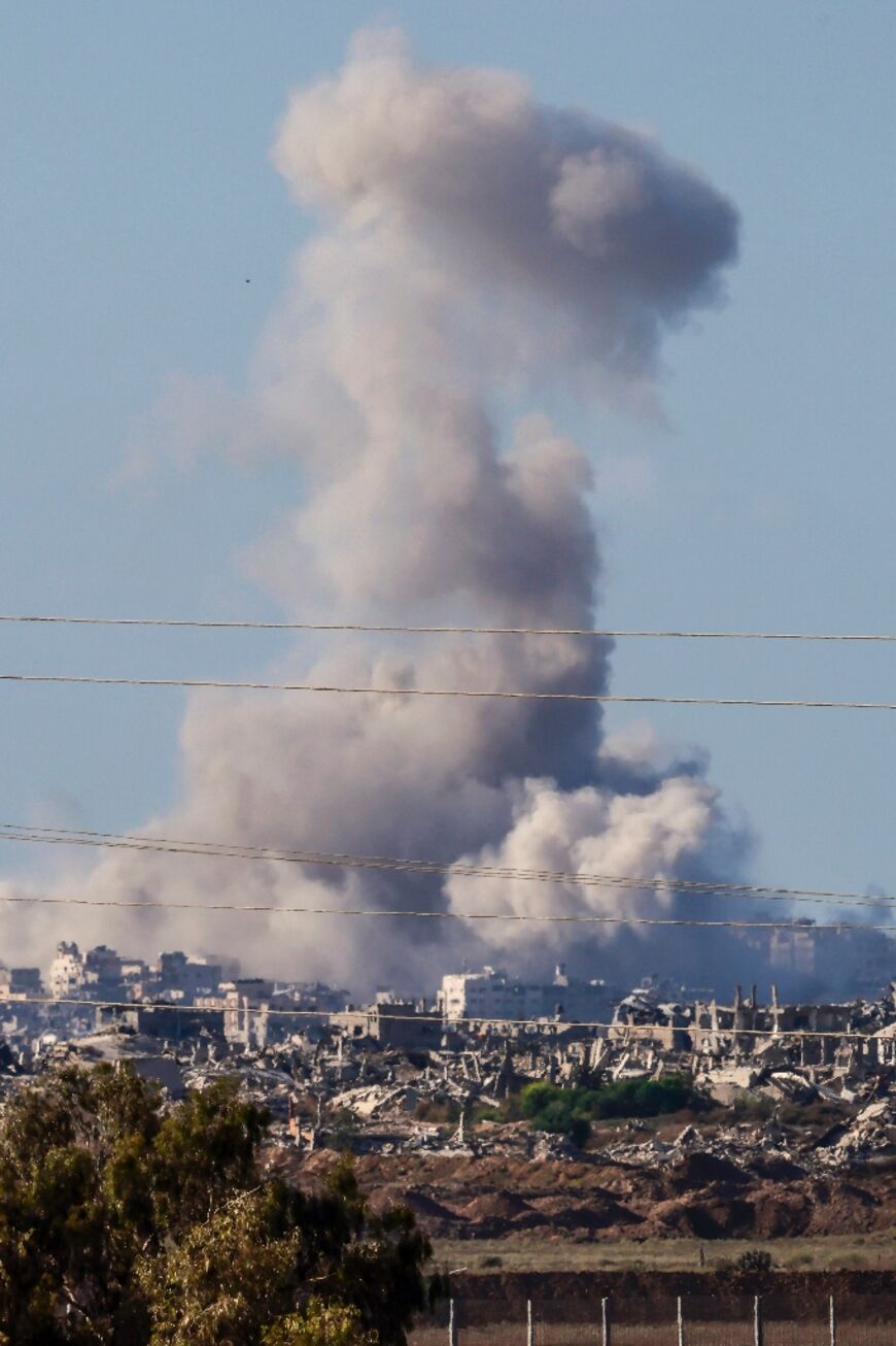 This picture taken from a position at Israel's border with the Gaza Strip shows smoke billowing amid Israeli bombardment of the besieged Palestinian territory on September 16, 2025