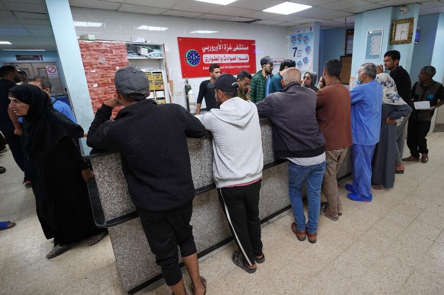 Palestinians line up for care at the European hospital in Khan Yunis in the southern Gaza Strip in May 2024
