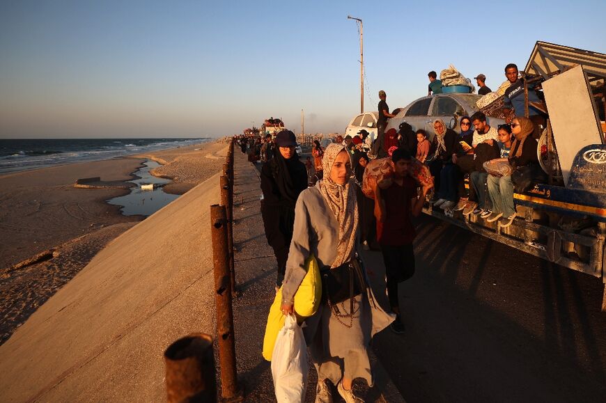 Displaced Palestinians moved with their belongings southwards on a road in the Nuseirat refugee camp area in the central Gaza Strip, as Israel presses its ground offensive to capture Gaza City
