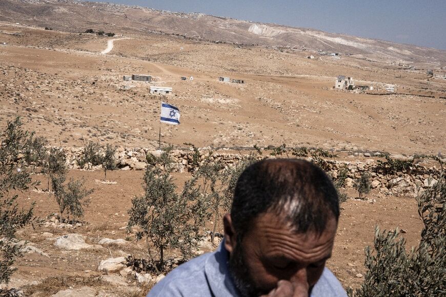An Israeli flag was planted in this Palestinian man's olive field