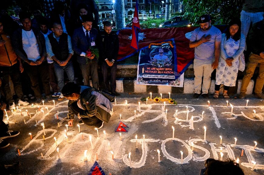 Mourners light candles and offer condolences in Kathmandu, Nepal during a candlelight vigil for Bipin Joshi, a Nepali agriculture student who died while being held hostage in Gaza