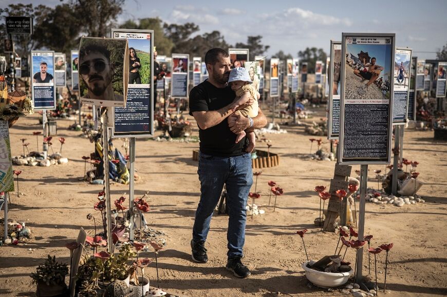A man walks through a memorial to victims of the October 7 attacks at in southern Israel a day before the anniversary