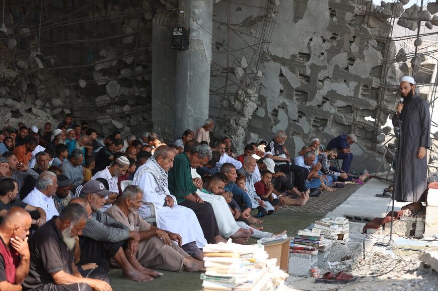 Palestinian Muslims took part in Friday prayers this week despite many of their mosques being redcued to rubble