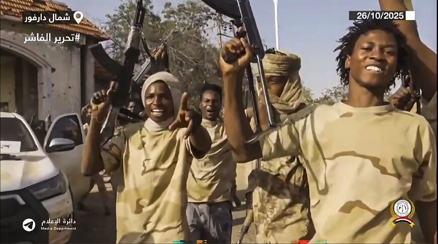 An image taken from handout video footage released by Sudan's paramilitary Rapid Support Forces showign its RSF fighters celebrating in the streets of El-Fasher after an 18-month siege