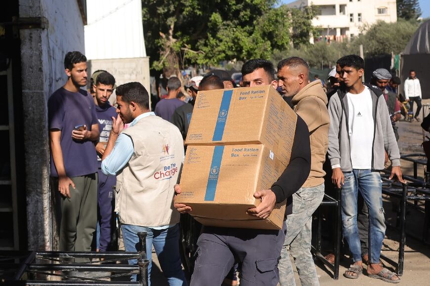 Israel is allowing some food aid through two checkpoints into Gaza but the main Rafah border crossing onto Egypt remains shut to humanitarian convoys  