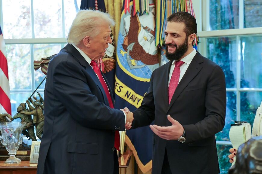 US President Donald Trump shakes hands with Syrian President Ahmed al-Sharaa at the White House in Washington 