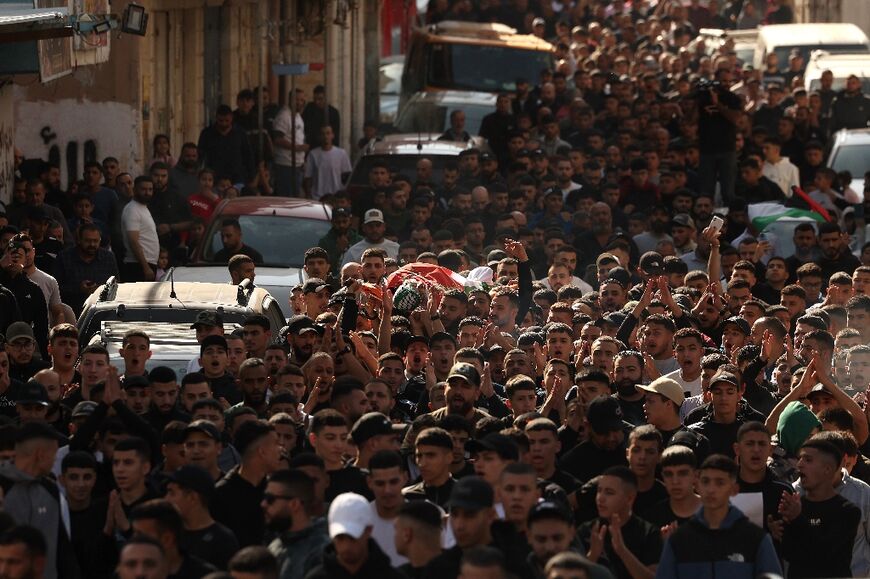 Mourners carried the body of Amr Khaled Ahmed al-Marbou during his funeral