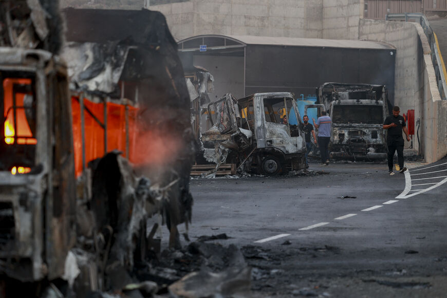 Burnt trucks after an attack by Israeli settlers in the village of Beit Lid, east of Tulkarm in the occupied West Bank, on November 11, 2025. Violence in the West Bank has surged since the outbreak of the Gaza war in October 2023, with frequent settler assaults on Palestinian towns and property. (Photo by Mohammad Nazal / Middle East Images via AFP) (Photo by MOHAMMAD NAZAL/Middle East Images/AFP via Getty Images)