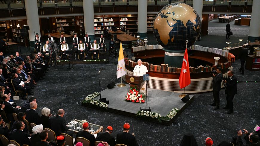 Pope Leo XIV speaks in front of Turkish President Tayyip Erdogan during a meeting with authorities, civil society, and the diplomatic corps at the National Library of the Presidential Palace in Ankara, on November 27, 2025. 