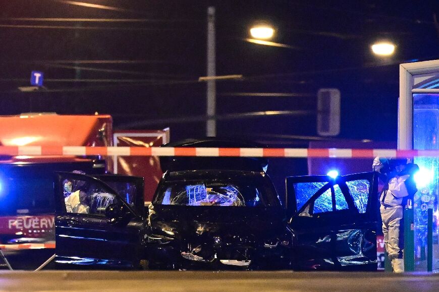 Forensic police inspect the car that drove through the crowd at a Christmas market in Magdeburg, eastern Germany